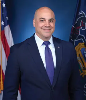 Professional portrait with American and state flags