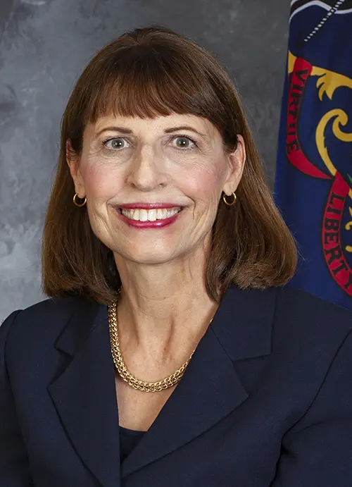 Smiling woman in a navy suit